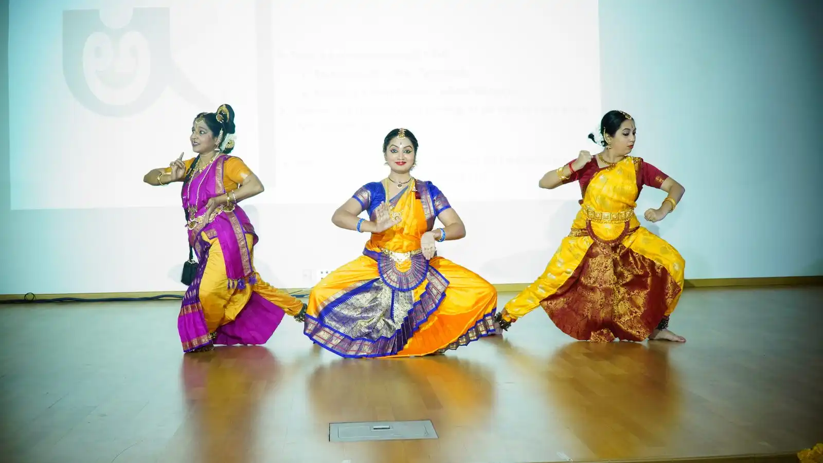 Kannada Rajyotsava 2023 — three dancers on stage
