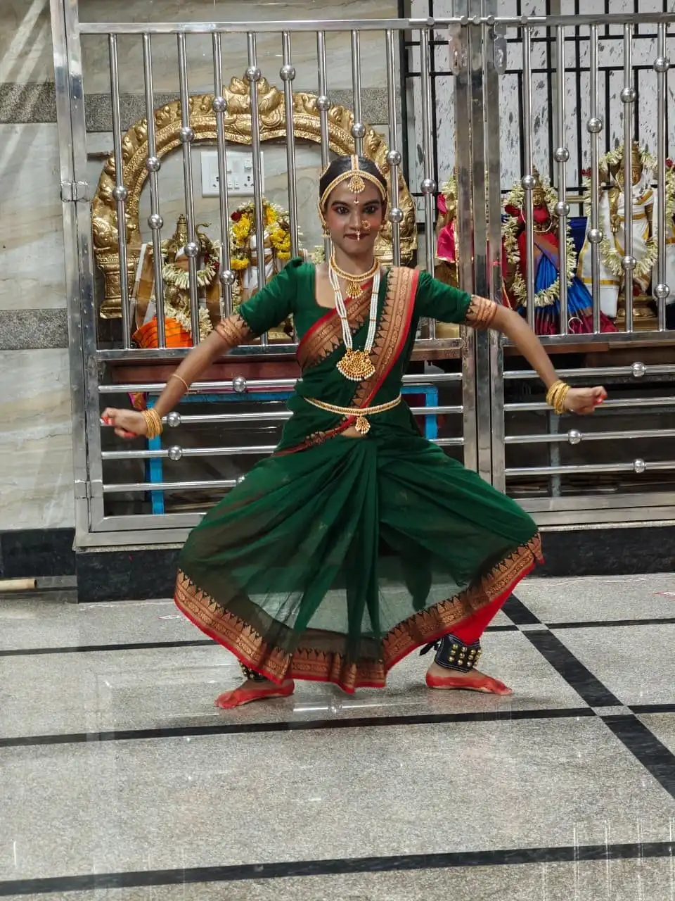 Student performing at Salangai Poojai